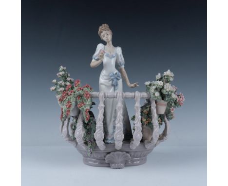 A gorgeous glossy figural scene of a lovely lady in a balcony surrounded by intricate floral foliage. Sculpted by Joan Coderc
