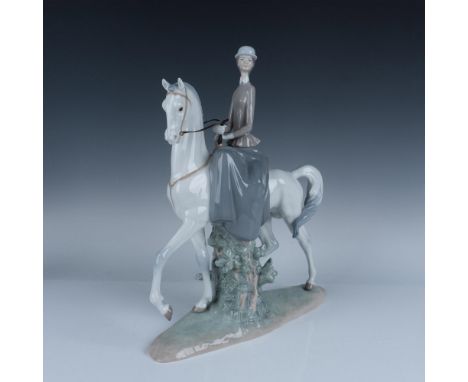 Glossy porcelain depiction of an elegant lady riding her majestic horse. Lladro backstamp. Artist: Fulgencio GarciaIssued: 19