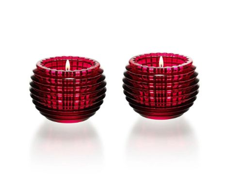 Depicts two radiant red crystal candle holders with a ribbed, layered design, creating a warm, elegant glow. 2810639. This it