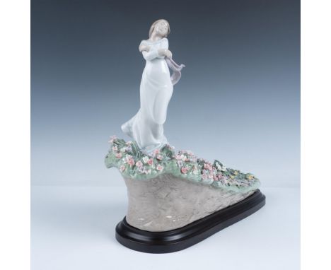 Glossy finish. Limited edition figure of a woman standing on a flower-covered hillside. Lladro backstamp. This item has its o