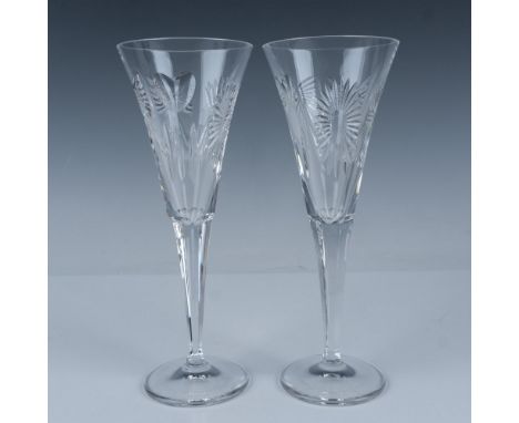 This pair of Waterford crystal Happiness flutes is from the Millennium Collection, A Toast to the Year 2000. Part of a specia