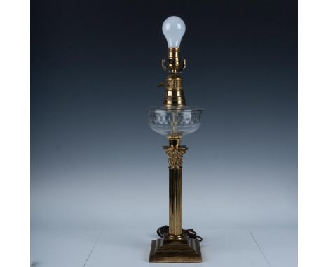 Vintage oil lamp with a gilt pedestal styled stem and a glass bowl patterned with hexagons. Leviton Made in USA backstamp nea