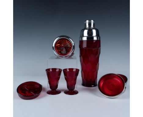Splendid collection of red glassware that includes a large faceted shaker, two footed shot glasses, four pinwheel coasters, t