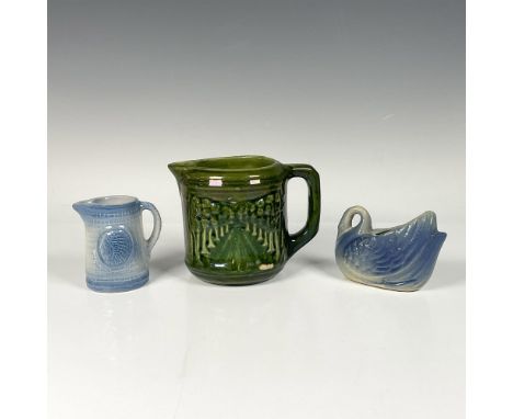 An excellent trio of early 20th century American pottery. A Brush McCoy forest green pitcher with a glazed finish depicts an 