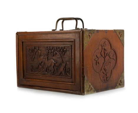 CHINESE MAHJONG SET, EARLY 20TH CENTURY  the wood case with carved panels of birds and flowers and with brass mounts and bras