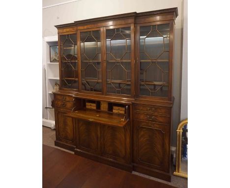 Mahogany Breakfront Library Secretaire Bookcase, Retailed by Gillespie & Woodside, Having four glazed Astragal doors enclosin