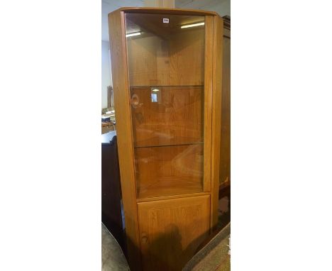 Ercol Windsor Corner Cabinet, Having a glazed door, Enclosing fitted glass shelves, Above a cupboard door, 196cm high, 80cm w