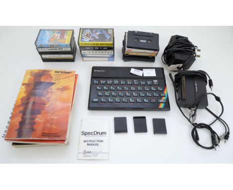 A Sinclair 2X Spectrum with power cable, 'Basic Programming' booklet, Microdrive and interface manual, 'Spectrum Machine Lang