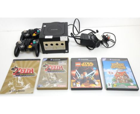 A black Nintendo GameCube with power cable, 2 controllers and 3 games including Lego Star Wars The Video Game, Pal version (w