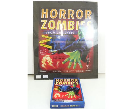 A Horror Zombies poster and a boxed Horror Zombies game with manual