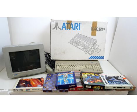 An Atari 1040STE computer system with mouse, cables, Atari SC1224 monitor and 7 games including Archipelagos (sealed), Resolu