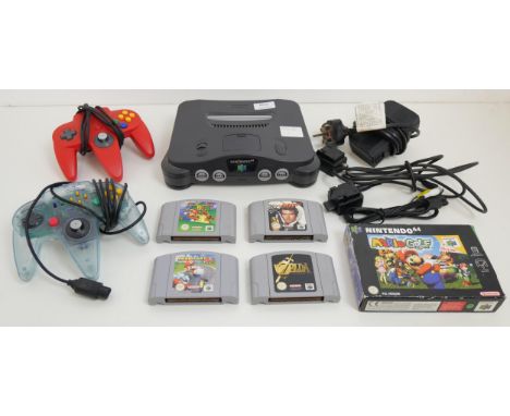 A Nintendo 64, 2 controllers, (1 original, 1 competition Pro) and 5 games, Mario Kart 64, Super Mario 64, 007 Goldeneye, The 