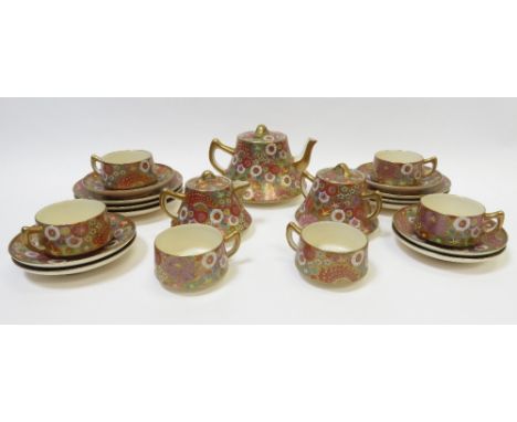 A Japanese Koshida six piece tea service comprising six side plates, six saucers, six tea cup, teapot, sugar and one other te