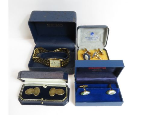 A pair of Halcyon Days silver gilt and enamel cufflinks, Birmingham 1995, depicting a hot air balloon; with a pair of silver 