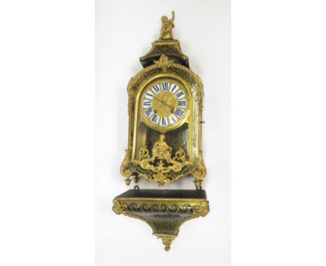 An early 19th century French bracket clock in a boulle case with blue enamelled numerals, engraved brass dial, the case havin