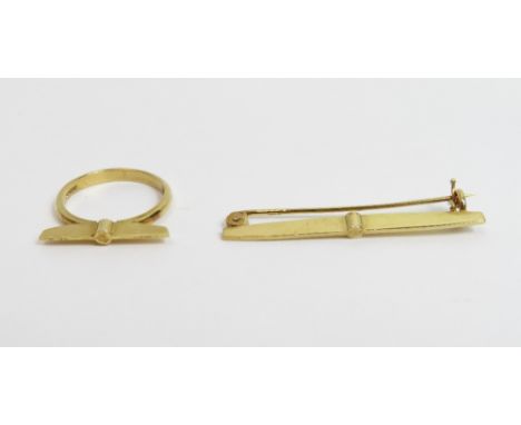 An 18 carat gold ring and brooch set, both of abstract wing shaped design, maker R&amp;PJ, London 1989, 6 g gross