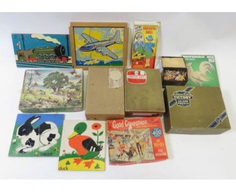 A small collection of vintage puzzles including Chad Valley