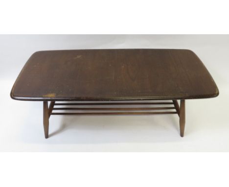 A mid century stained Ercol coffee table, 36cm high, 104cm long, 46cm deep