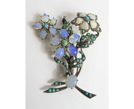 An opal and turquoise spray brooch, unmarked, set in silver, 6.5cm long