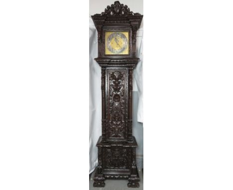 A late 19th century musical longcase clock with brass 14.5 inch dial and secondary seconds dial striking on bells and gongs b