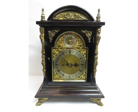 A late 19th century bracket clock the brass arched dial having silvered chapter ring and regulator dial, twin train fusee mov
