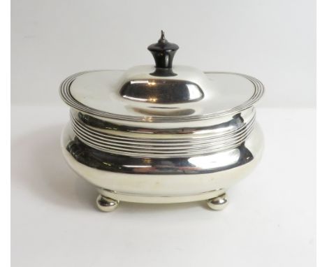 An Edwardian silver tea caddy, by J. Round, Sheffield 1904, in the Georgian style, of rounded rectangular outline, reeded ban