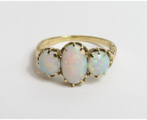 An opal three stone ring, stamped '18ct', finger size O, 3.1g gross