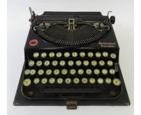 A Remington Portable typewriter in a black case