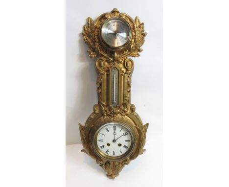 A clock, barometer in gilt case with a white enamel dial