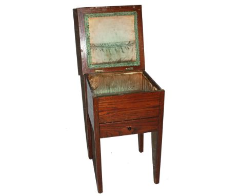 An early 20th century oak lady's workbox with lift up lid, fitted interior, shelf under, raised on square legs