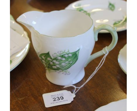 A Shelley twenty-one piece tea service in the 'Lily of the Valley' range, to include cups, saucers, plates, sugar bowl, jug a