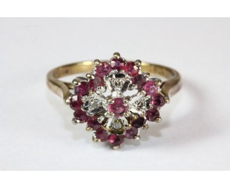 A 9ct gold ruby and diamond cluster ring (M)