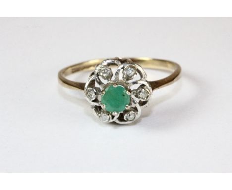 A 9ct gold emerald and diamond ring (M)