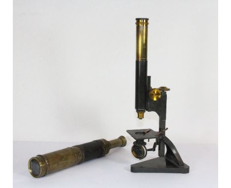 An antique brass telescope and microscope