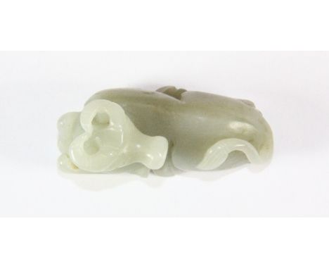 A 19th/early 20thC Chinese carved celadon jade figure of a bull, L 6cm