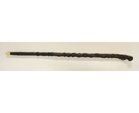 A 19th century carved wooden walking stick featuring a mans head, a frog and a snake, L 86cm
