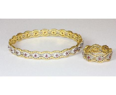 A 14ct gold yellow and white gold bangle and matching ring set with rubies (31g approx)