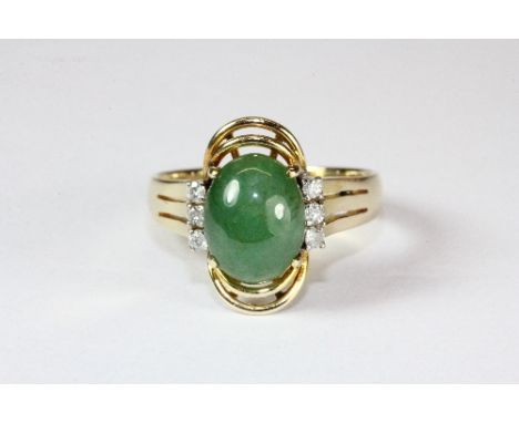 A 14ct gold jade and diamond ring (M)