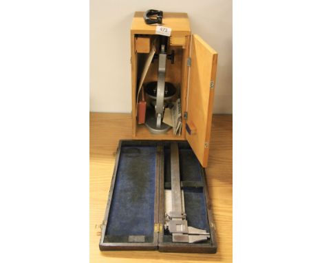 A cased microscope and micrometer