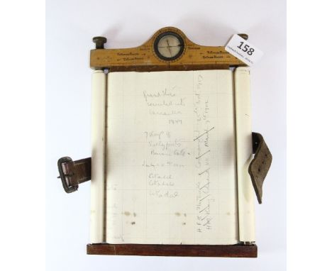 An early 20th century map makers compass/note board
