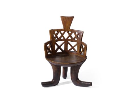 GURAGE CHAIRETHIOPIA wanza wood, carved from a single trunk, rising from three splayed legs, round seat with open worked back