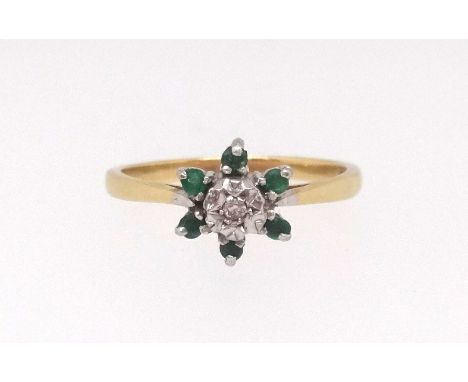 An 18ct emerald and diamond cluster ring, size O.