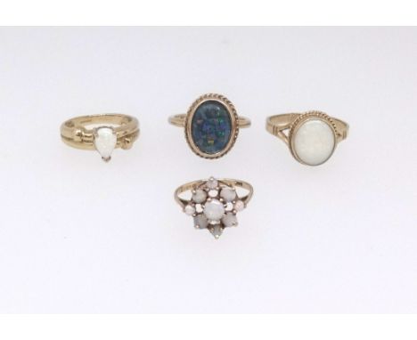 Four 9ct gold opal set various dress rings, approx 14.5gms.