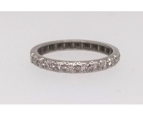 A white gold half band diamond set eternity ring, size Q.