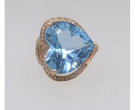 A 14k yellow gold and diamond ring set with a heart shape blue topaz approx 10ct diamonds, approx 0.40ct total weight, size M