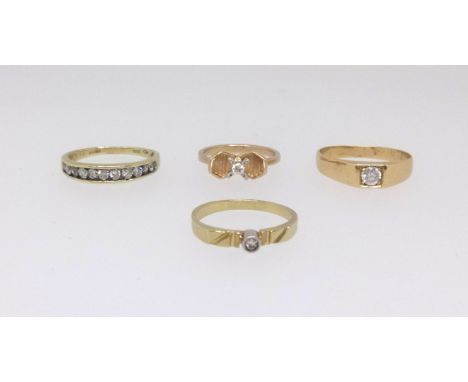 Four 18ct gold and diamond set dress rings including a nine stone channel set and half band eternity ring, approx 12.3gms.