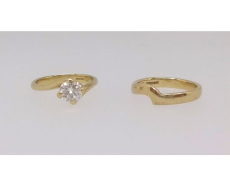 An 18ct diamond solitaire ring approx 0.64ct of good colour and clarity together with a 18ct shaped wedding band with receipt