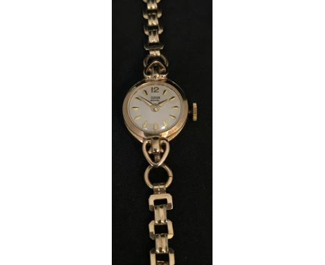 Tudor, Royale a ladies 9ct yellow gold manual wind cocktail watch with silver baton dial, Rolex crown, gold plated bracelet, 