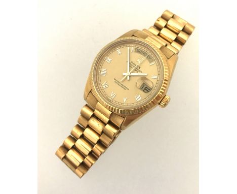 Rolex, a 1978 gents 18ct gold Day Date wristwatch, Model 18038, Serial 5349979, overhauled and serviced by Rolex in 2005, wit