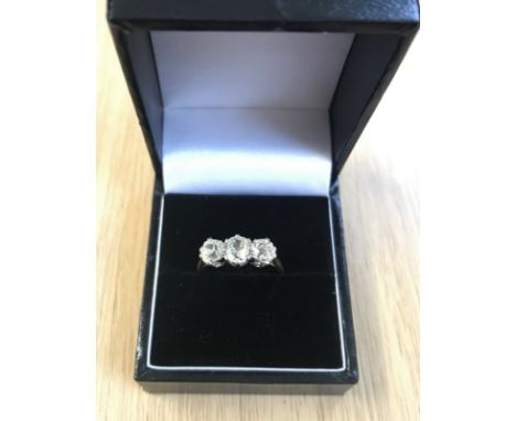 An 18ct three stone diamond ring, total diamond weight approx 1.50ct, size O.